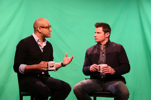 Jack Rico interviewing a guest on a green screen set