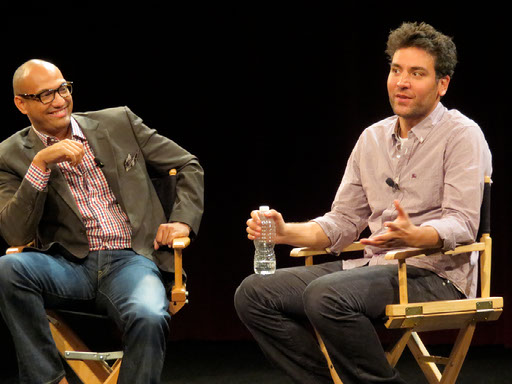 Jack Rico moderating a stage conversation with Josh Radnor